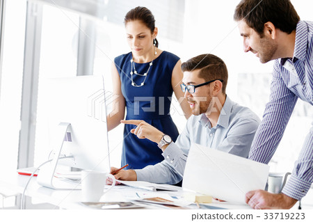 Business people in modern office Business people in modern office 33719223