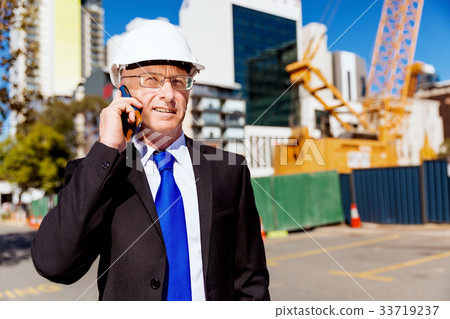 Businessman at construction site Businessman at construction site 33719237