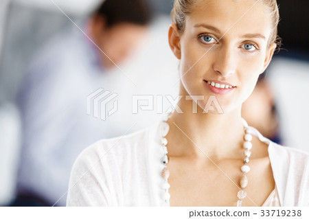 Attractive female worker in office 33719238