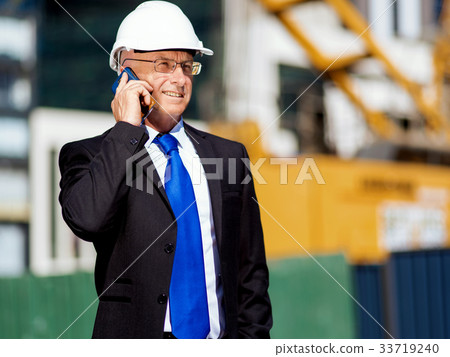 Businessman at construction site 33719240