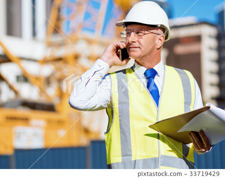 Engineer builder at construction site Engineer builder at construction site 33719429