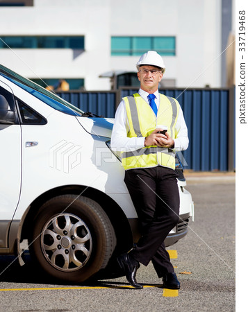 Engineer builder at construction site 33719468