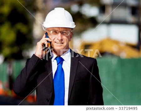 Businessman at construction site 33719495