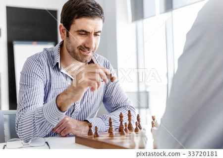Portrait of two young man playing chess Portrait of two young man playing chess 33720181
