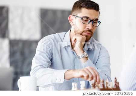 Portrait of two young man playing chess 33720196