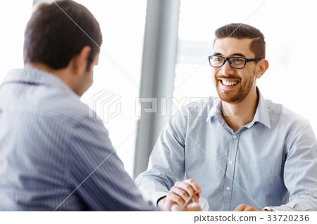 Two handsome businessmen in office Two handsome businessmen in office 33720236