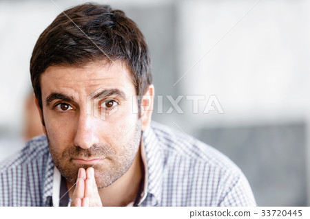 Male office worker sitting at desk 33720445