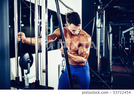 Young Bodybuilder Doing Exercise For Biceps Young Bodybuilder Doing Exercise For Biceps 33722454