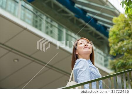 Smiling woman going out Smiling woman going out 33722456