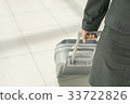 Businesswoman dragging luggage 33722826