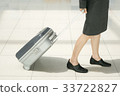 businesswoman dragging luggage 33722827