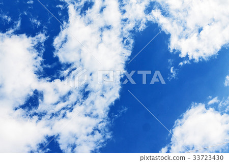White fluffy clouds on a clear blue sky 33723430