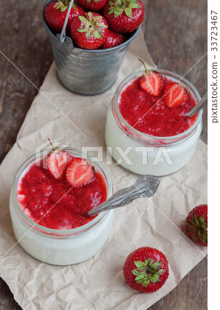 Yogurt with jam sauce in glass and a bucket  33723467