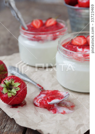 Yogurt with jam sauce in glass and a bucket  33723469
