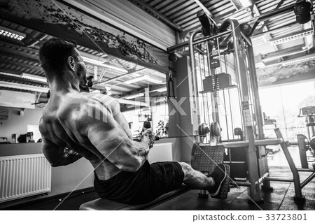 Strong Bodybuilder Doing Heavy Weight Exercise For 33723801