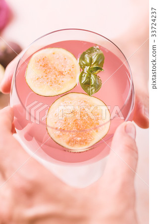 Pink cocktail with fig 33724237