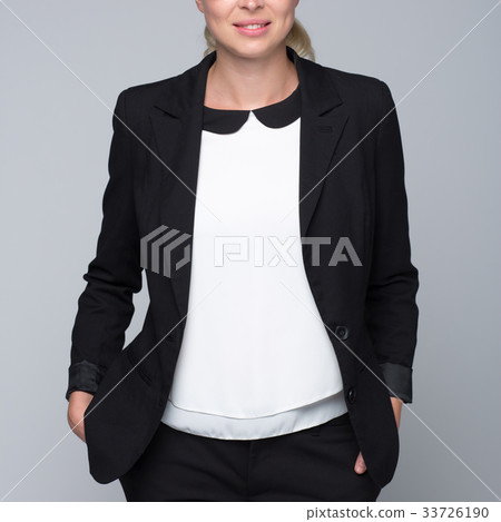 Beautiful young woman in business attire. Beautiful young woman in business attire. 33726190
