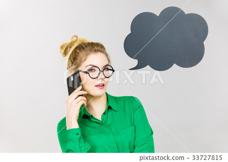 Business woman talking on phone with thinking bubble Business woman talking on phone with thinking bubble 33727815