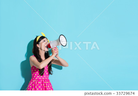 happy beautiful woman using megaphone speaking 33729674