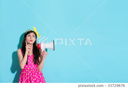 sweet elegant lady in blue background daydreaming sweet elegant lady in blue background daydreaming 33729676