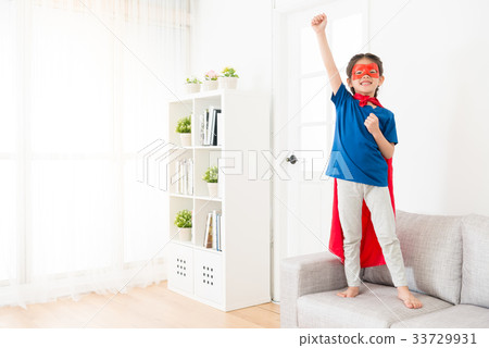 happy female children wearing superhero clothing 33729931
