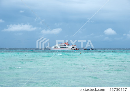 Ferry ship with wooden long tail boat on sea Ferry ship with wooden long tail boat on sea 33730537