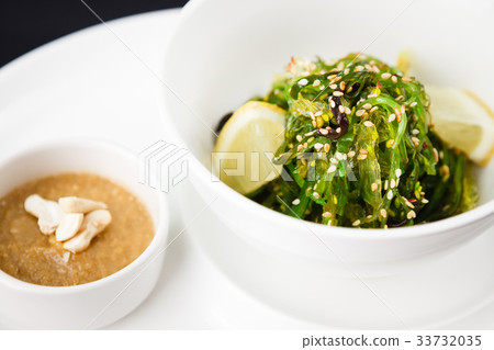 Seaweed salad with a sauce Seaweed salad with a sauce 33732035