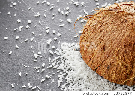 Coconut shreds on a dark slate background 33732877