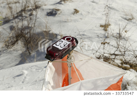 Orienteering control point in a snow field Orienteering control point in a snow field 33733547