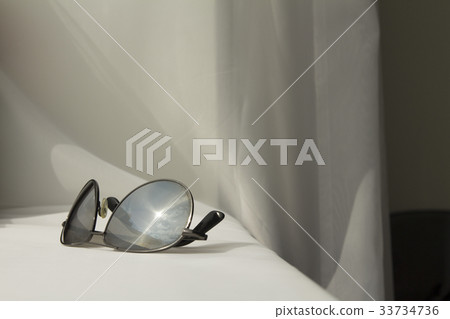 Black man sunglasses on white cloth background 33734736