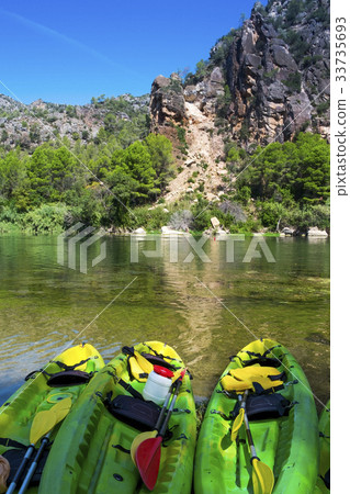 kayaks at the Ebro River in Benifallet, Spain kayaks at the Ebro River in Benifallet, Spain 33735693
