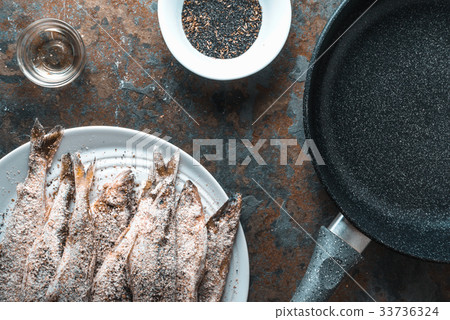 Frying pan, smelt on the plate, salt and spices 33736324
