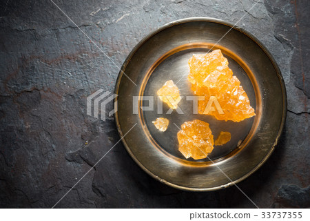 Crystalline grape sugar on a tin plate Crystalline grape sugar on a tin plate 33737355