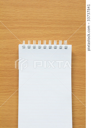 Blank lined paper on wood table for writing 33737841