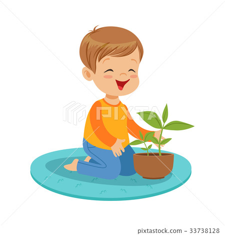 Cute happy little boy sitting on the floor and 33738128