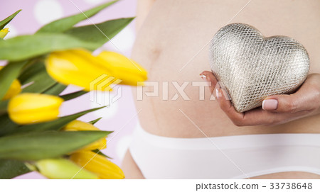 Close up of a cute pregnant belly, Heart Close up of a cute pregnant belly, Heart 33738648