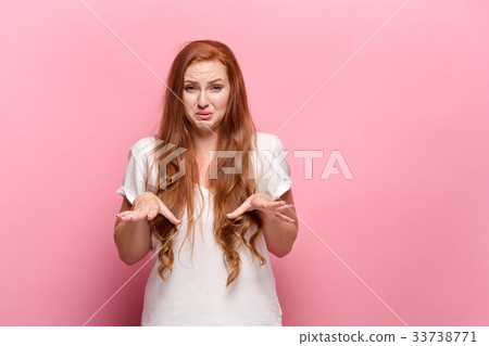The beautiful woman is offended on pink studio The beautiful woman is offended on pink studio 33738771