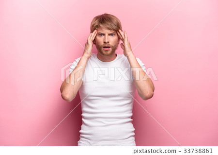 Studio shot of thoughtful young man 33738861