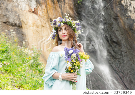 Portrait of a girl with a wreath on her head and a Portrait of a girl with a wreath on her head and a 33739349