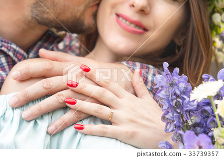 close-up of a hands hugging couple of guy and his close-up of a hands hugging couple of guy and his 33739357