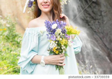 Portrait of a girl with a wreath on her head and a 33739359