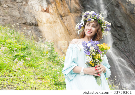 Portrait of a girl with a wreath on her head and a Portrait of a girl with a wreath on her head and a 33739361