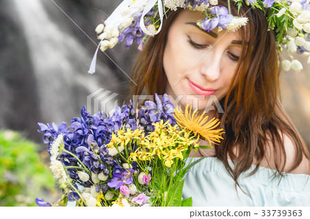 Portrait of a girl with a wreath on her head and a Portrait of a girl with a wreath on her head and a 33739363