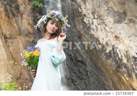 Portrait of a girl with a wreath on her head and a Portrait of a girl with a wreath on her head and a 33739367