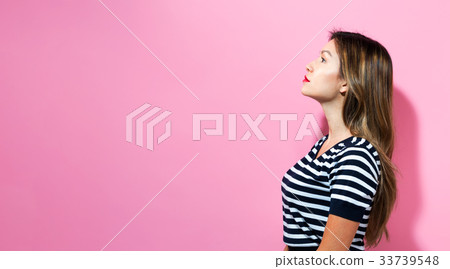 Young woman standing Young woman standing 33739548