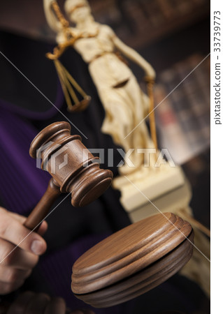 Law concept, Male judge in a courtroom striking  33739773
