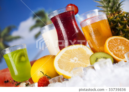 Fresh tropical fruits,Summer drink and palm branch Fresh tropical fruits,Summer drink and palm branch 33739836