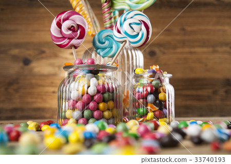 Colorful candies in jars on table on gum balls Colorful candies in jars on table on gum balls 33740193