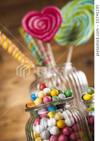 Colorful candies in jars on table on gum balls Colorful candies in jars on table on gum balls 33740195