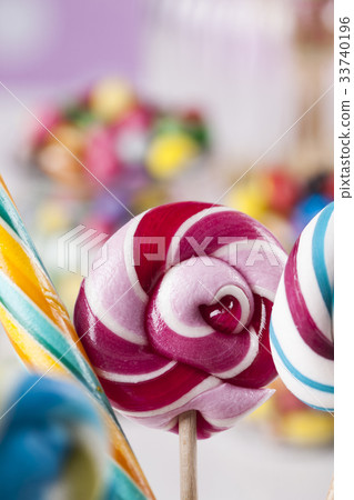 Colorful candies in jars on table on gum balls Colorful candies in jars on table on gum balls 33740196